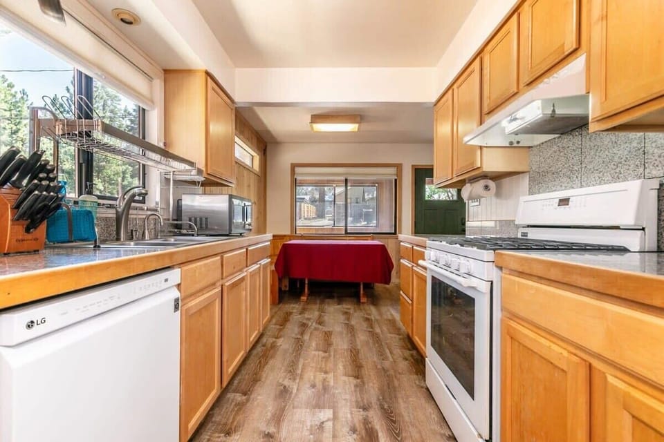 The fully equipped kitchen has ample counter space and all of the kitchenware you’ll need for home cooked meals.