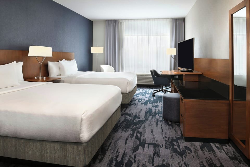 Room, 2 Queen Beds | In-room safe, desk, iron/ironing board, free cribs/infant beds