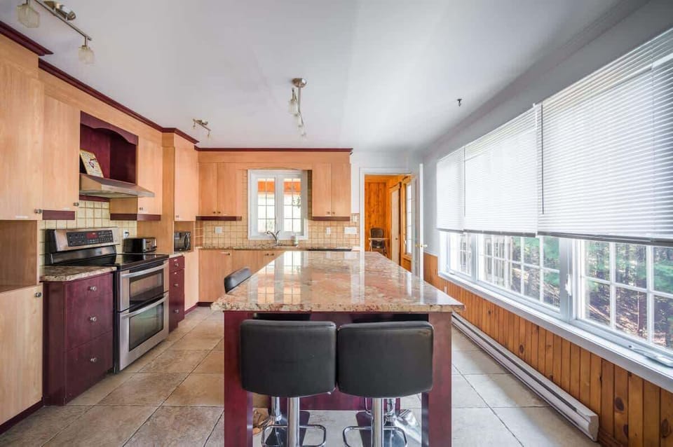 Bright countertops that enhance the kitchen’s clean and modern look—perfect for cooking and prep.