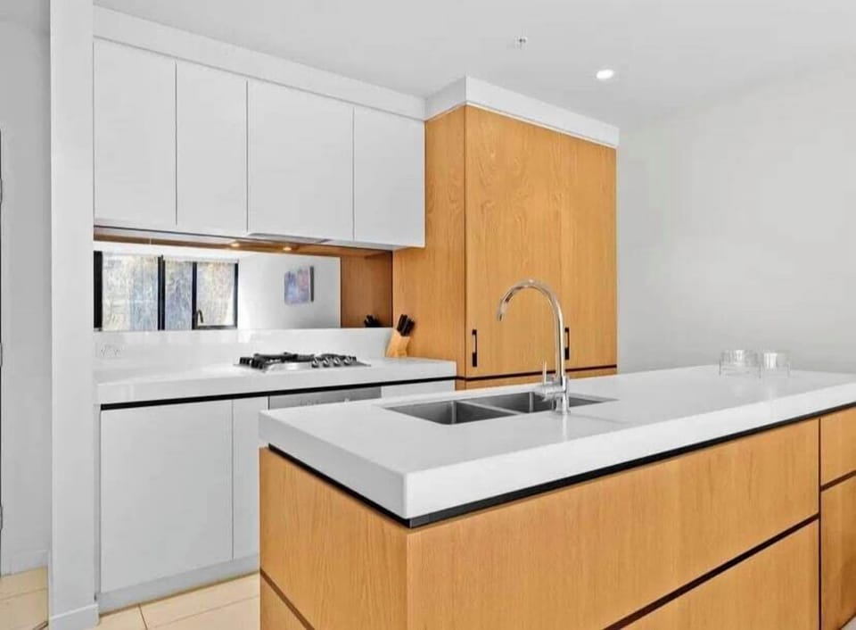 The compact kitchen is equipped with the appliances and utensils you'll need to cook a meal at home.