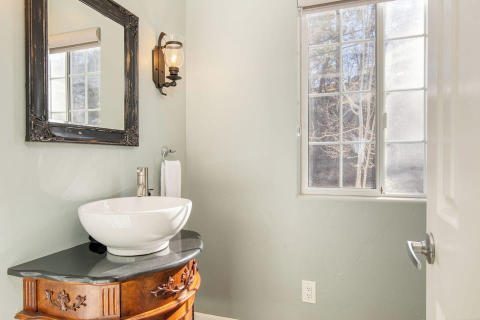 Bathroom 3 is on the main level near the foyer.