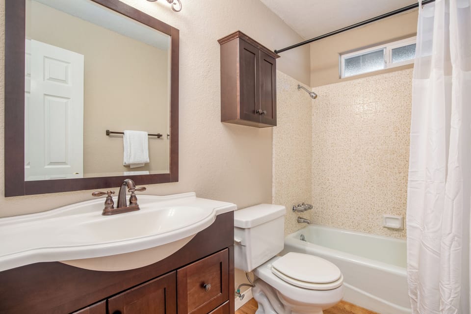 Bathroom 2 is on the lower floor and features a shower/tub combo.