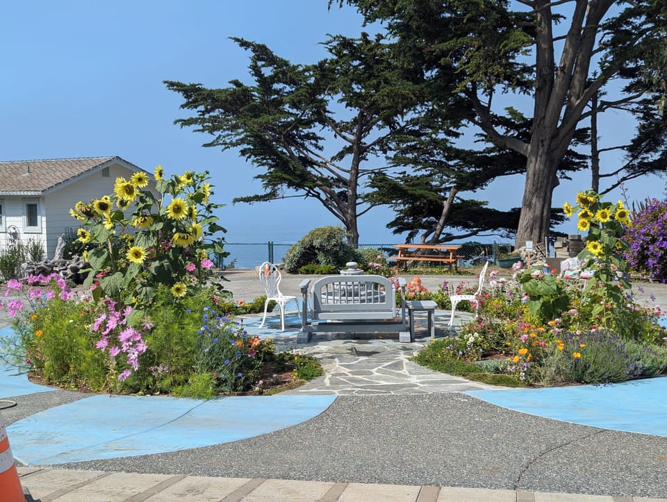 There's a swinging loveseat in the front courtyard with an ocean view.