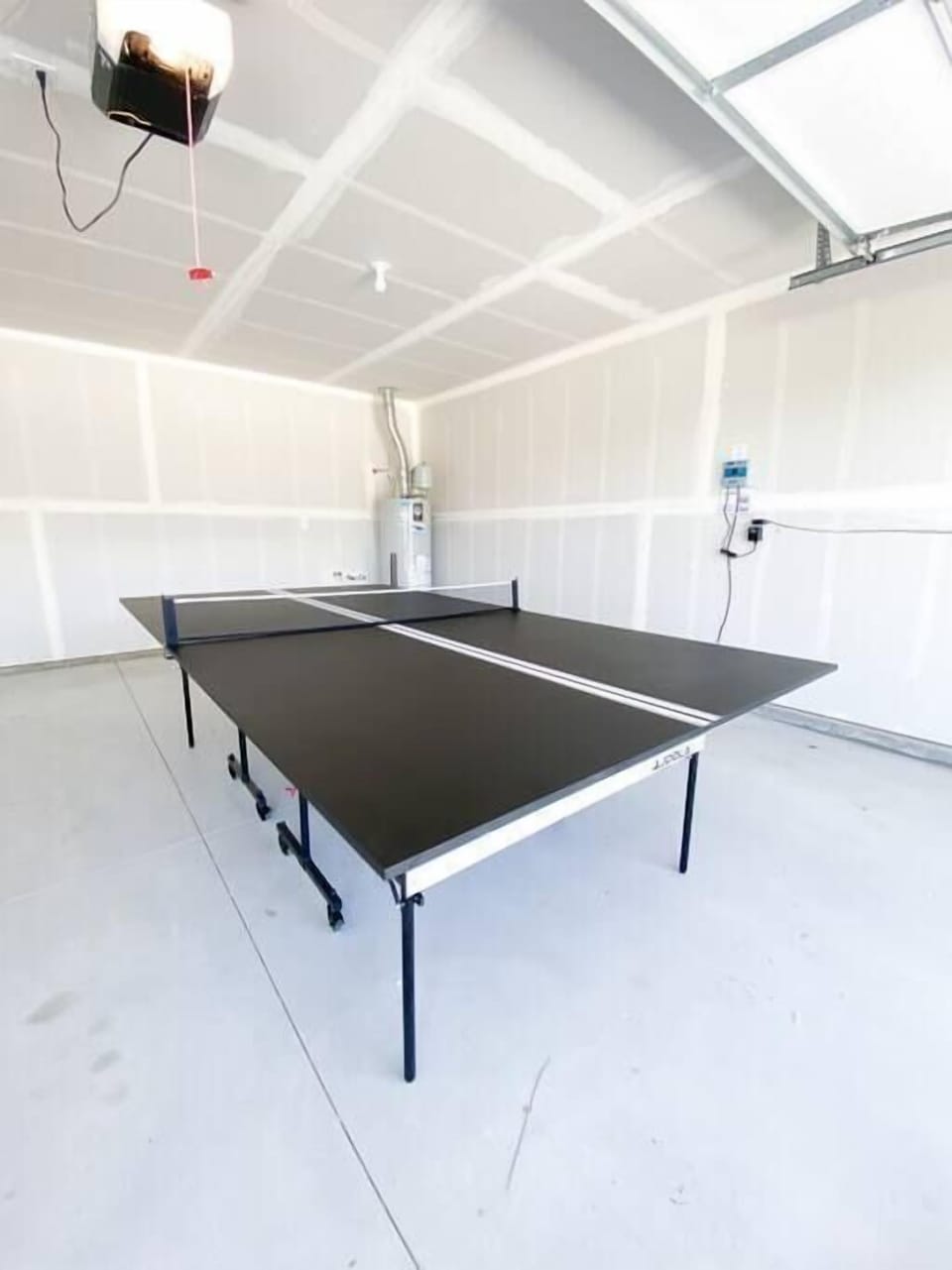 The ping pong table in the garage is all yours to use!