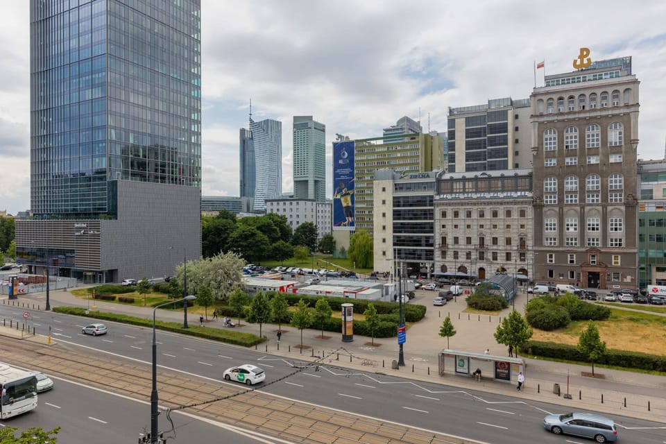 A cityscape view from the apartment, showcasing modern buildings and urban charm.
