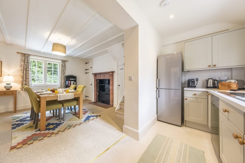 Open archway seamlessly leading through to the dining and sitting area