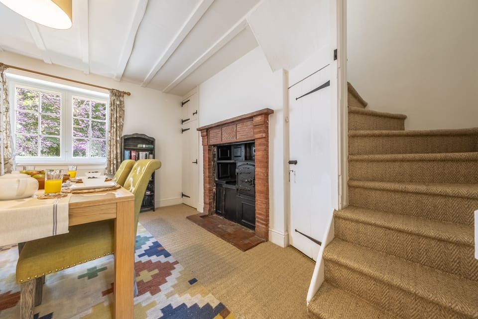 Staircase leads from the dining area to the first floor
