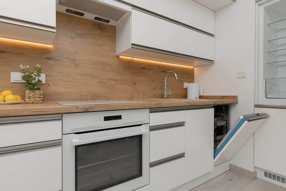 A closer view of the kitchen, highlighting modern finishes and ample storage.

