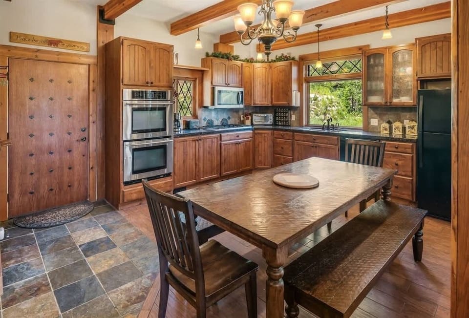 Open kitchen layout with dining room table.