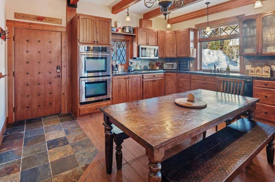 Kitchen is well appointed with beautiful heated slate floors.