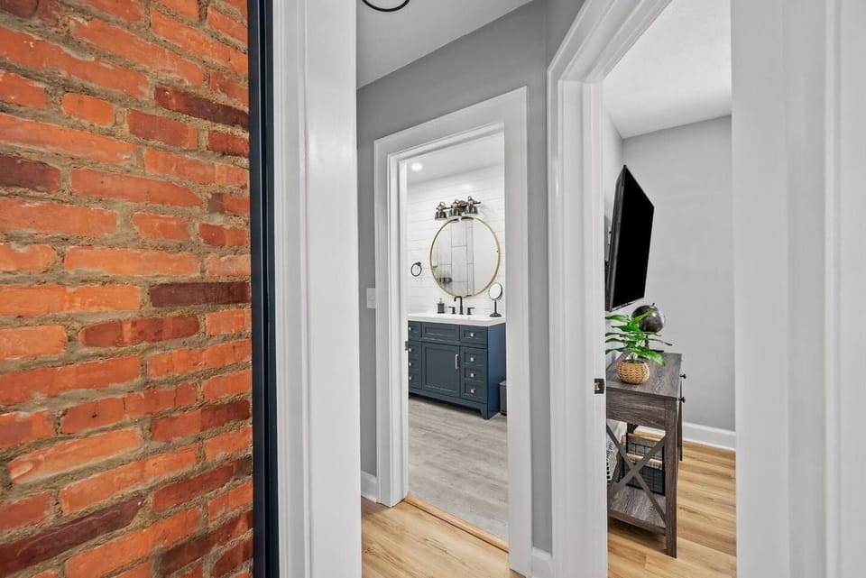 First Floor hallway into the full bathroom and Downstairs bedroom. 