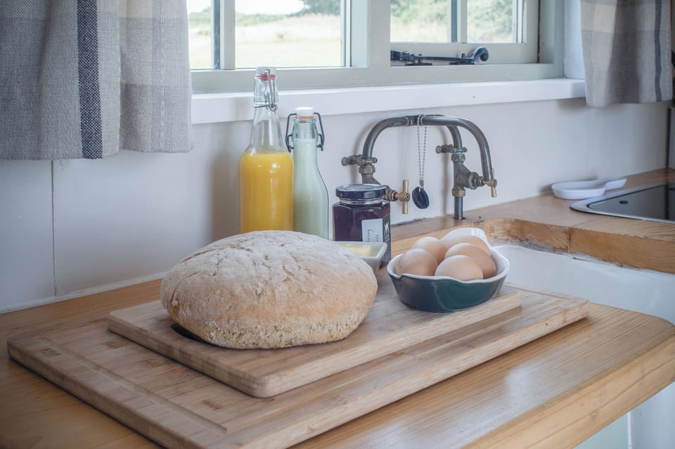 Fridge, stovetop, electric kettle, cookware/dishes/utensils
