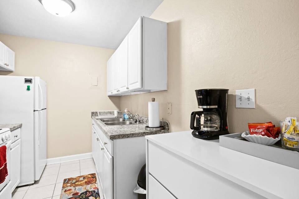 White bright kitchen with coffee station for your convenience