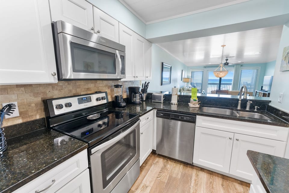 Your fully equipped kitchen awaits with granite countertops, stainless steel appliances, and an open layout perfect for creating memorable meals together.