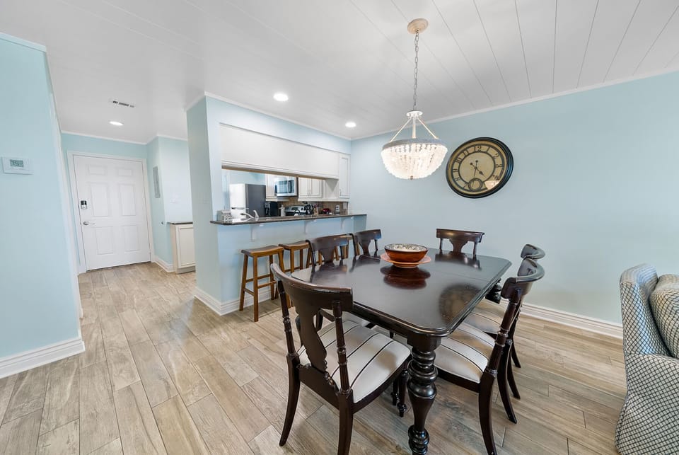 Gather around your elegant dining table for memorable meals while the chandelier casts warm light over conversations that'll last long into the evening.