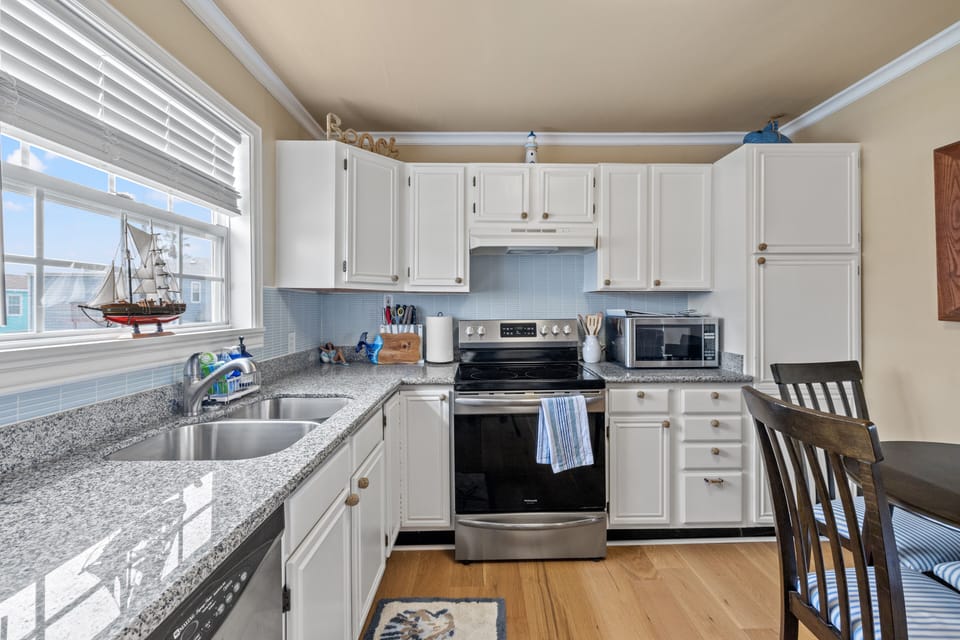 Full stove, oven, microwave, and dishwasher.