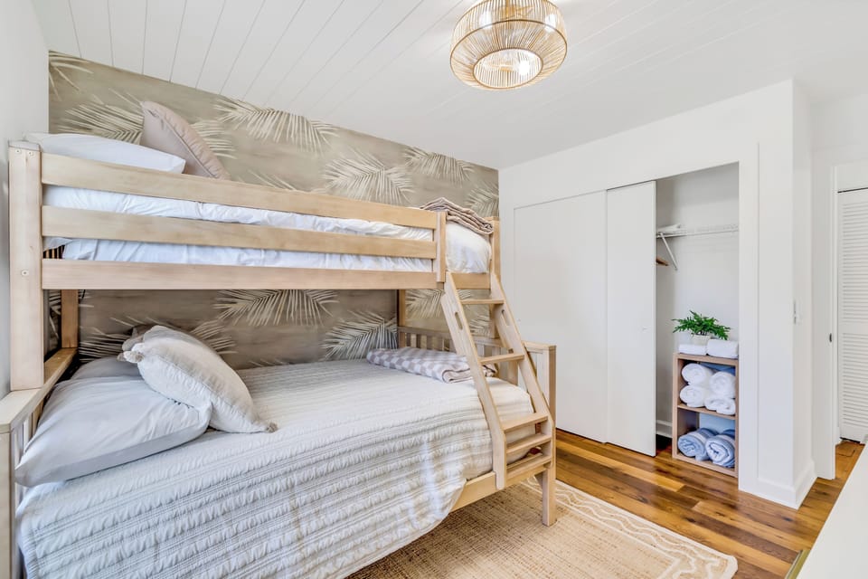 The bunk room also has a large closet with a portable crib available for use, plenty of towels and washcloths, and hangers. Smart TV and sound machine are also featured in this room.