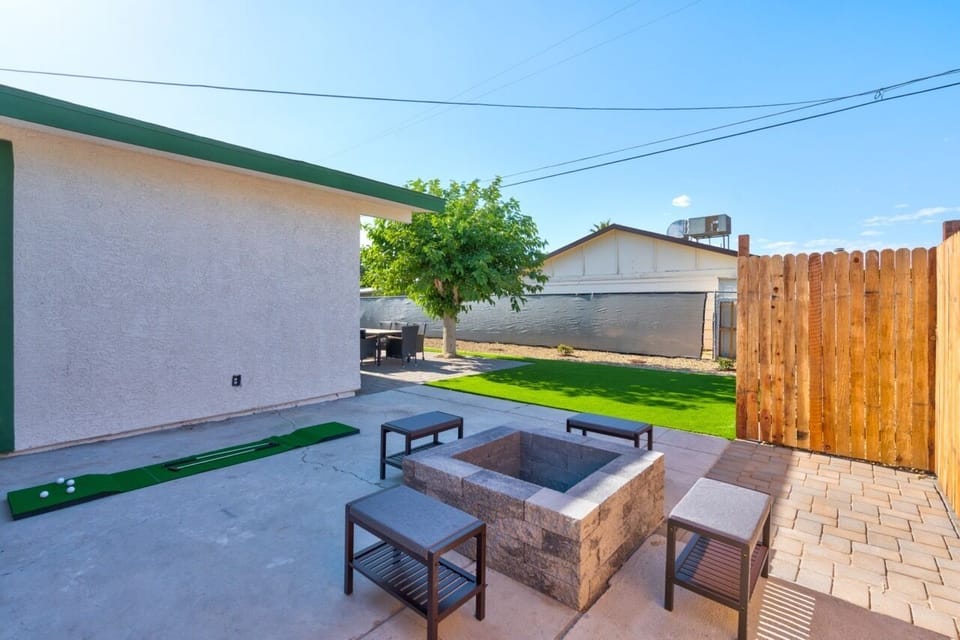 Lush Backyard with Firepit, Dining, Games like golf pong/cornhole, and BBQ Grill