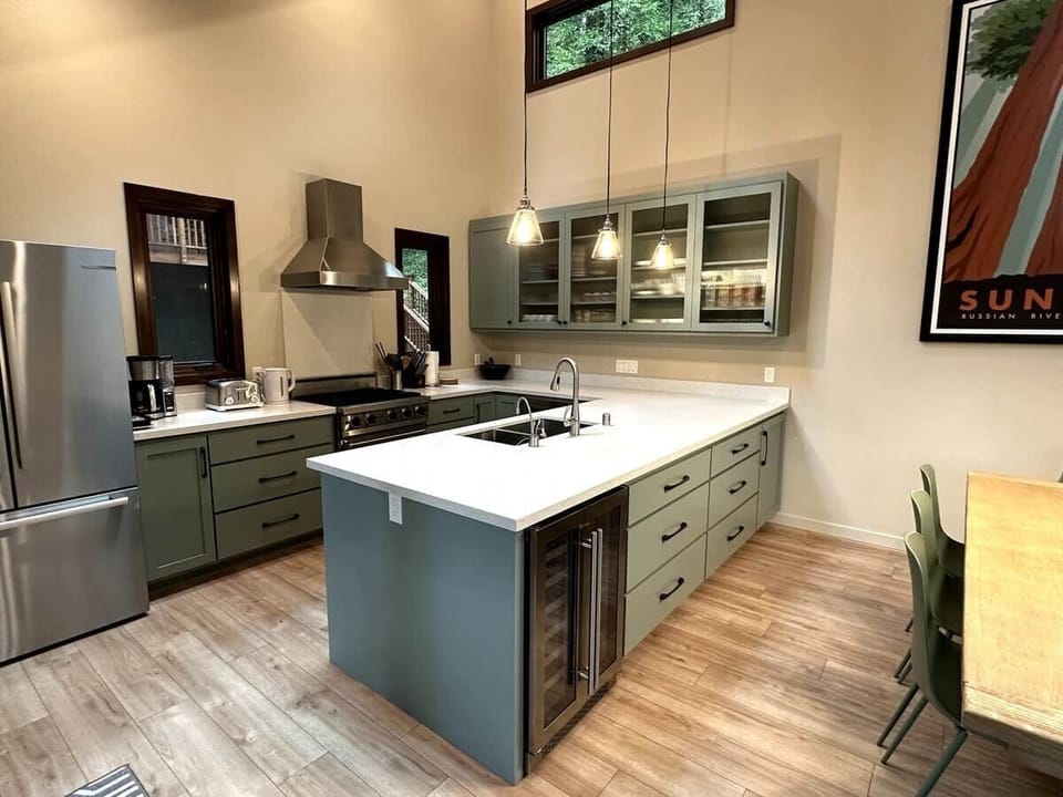 The new kitchen has all of the modern amenities for home cooking including a Viking propane gas stove, dishwasher, microwave oven, and wine/beverage fridge.