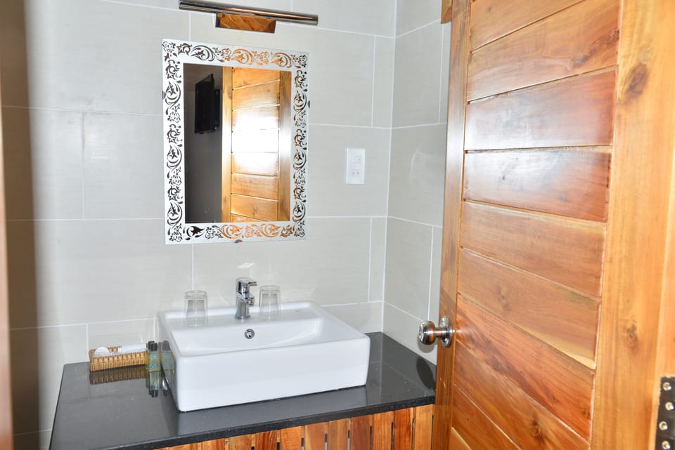 Shower, eco-friendly toiletries, hair dryer, slippers