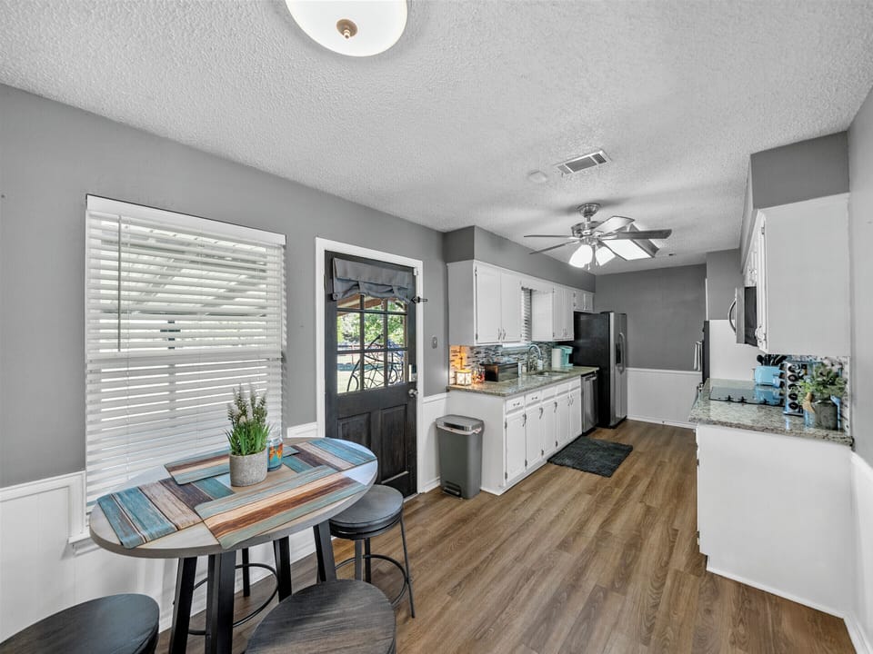 Eat in Kitchen area with folding tables available for larger meals!! 