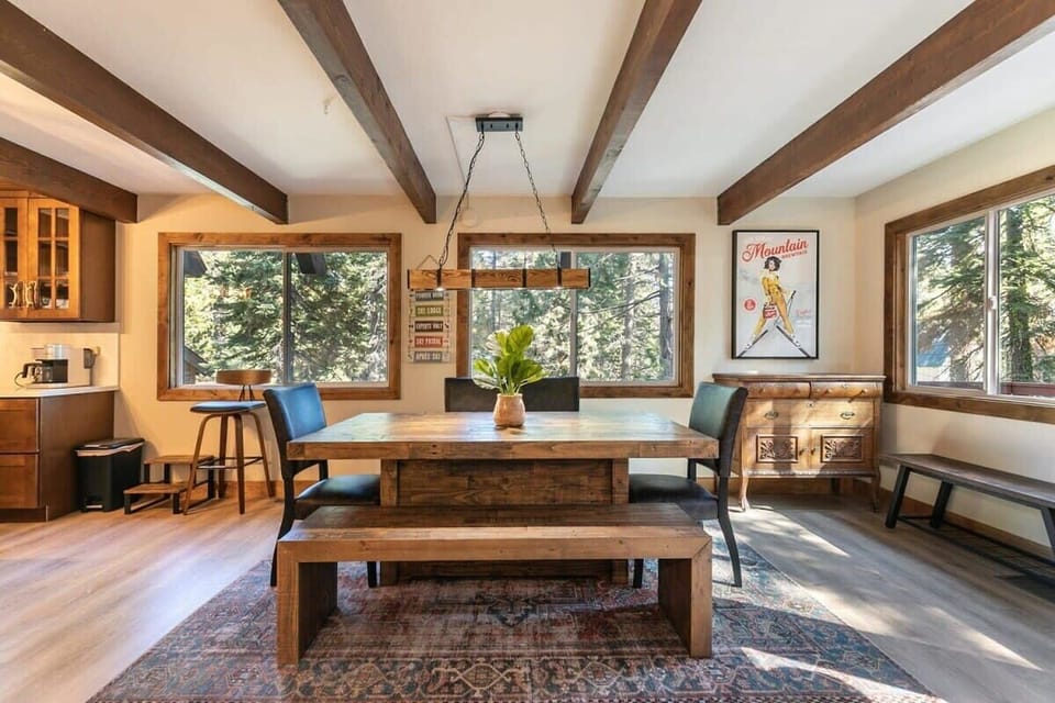 The dining area sits adjacent to the living room so you can stay connected to your group whether you are eating a snack or warming up by the fire.