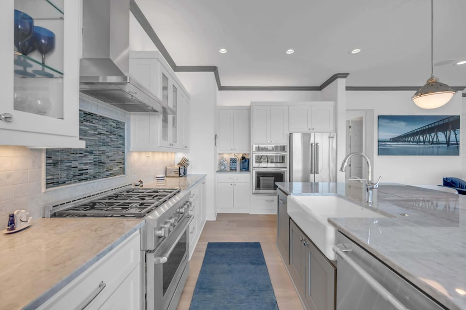 Kitchen fully equipped with stove, ovens, microwave, fridge/freezer, dishwasher, and keurig coffee maker