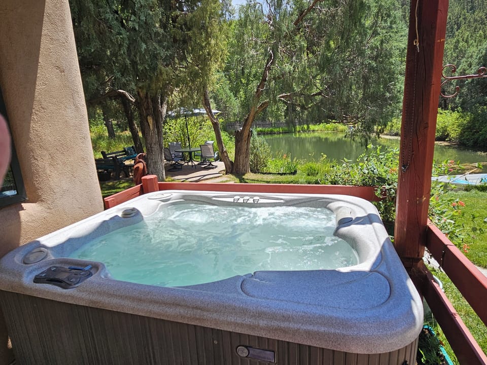 The Hot Tub which is right outside the King Master Bedroom is covered and overlooks the pond and backyard area.