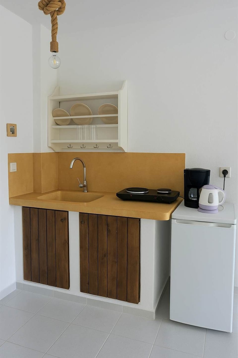 Practical Kitchenette Area Equipped for Light Cooking and Convenient Meal Preparation