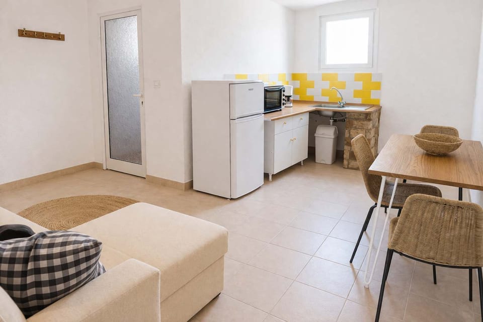 Compact Kitchenette Area with Modern Appliances for Light Cooking and Coffee Breaks
