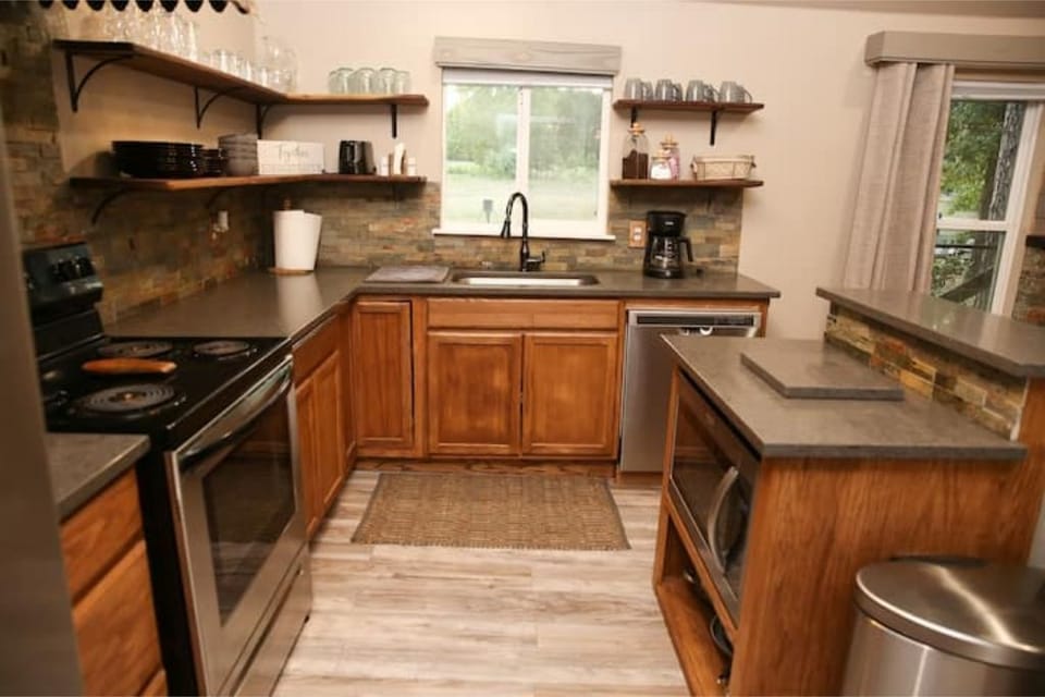There's a full kitchen with full-sized appliances, coffee maker & toaster.