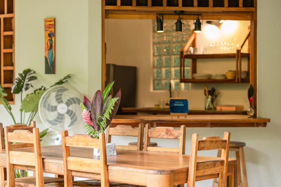 Warm wooden dining area and breakfast bar at Osos Caribeños in Playa Chiquita