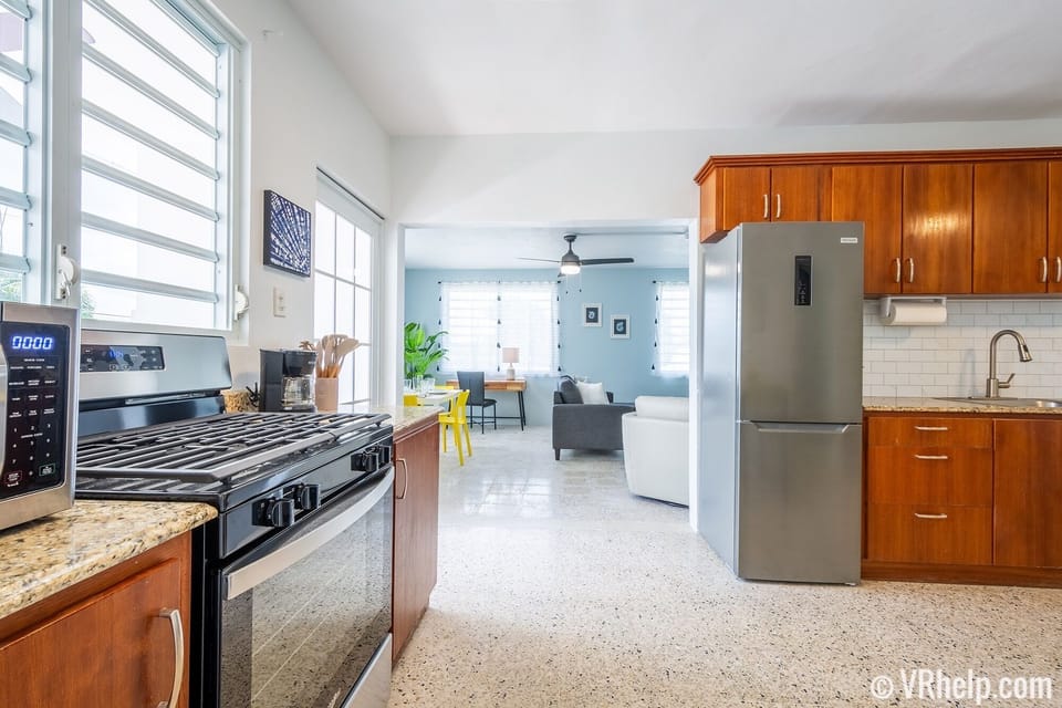 Fully stocked kitchen w/ gas range, microwave, coffee maker, toaster, blender.
