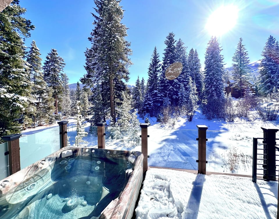 The hot tub off the main deck offers great views of the trees and ski mountain.