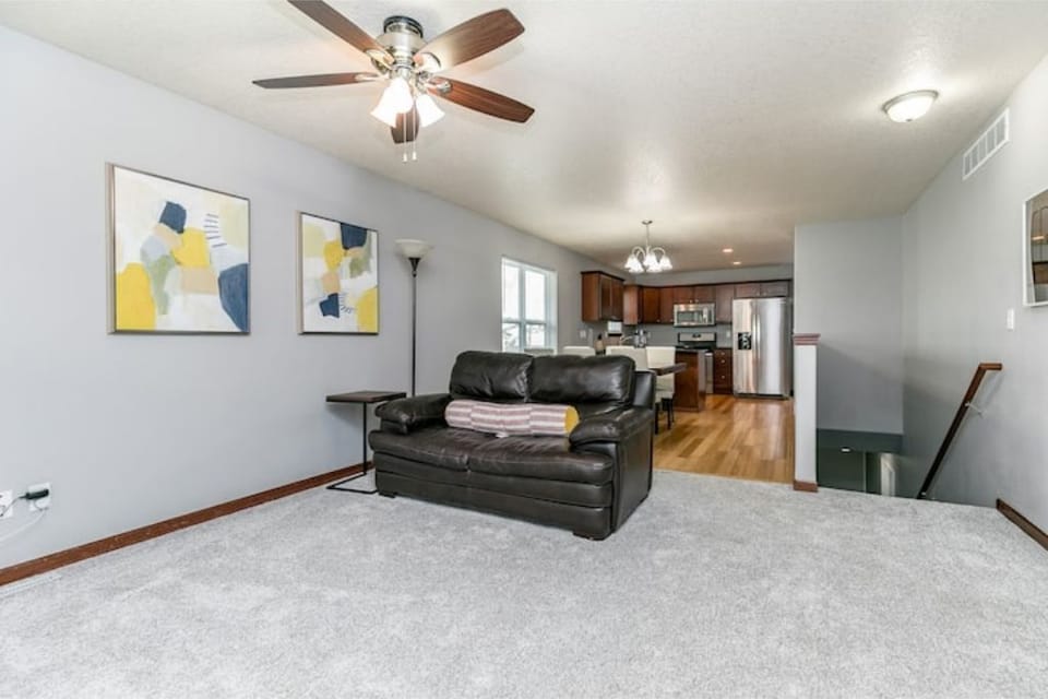 Main floor living room looking to dining area and kitchen