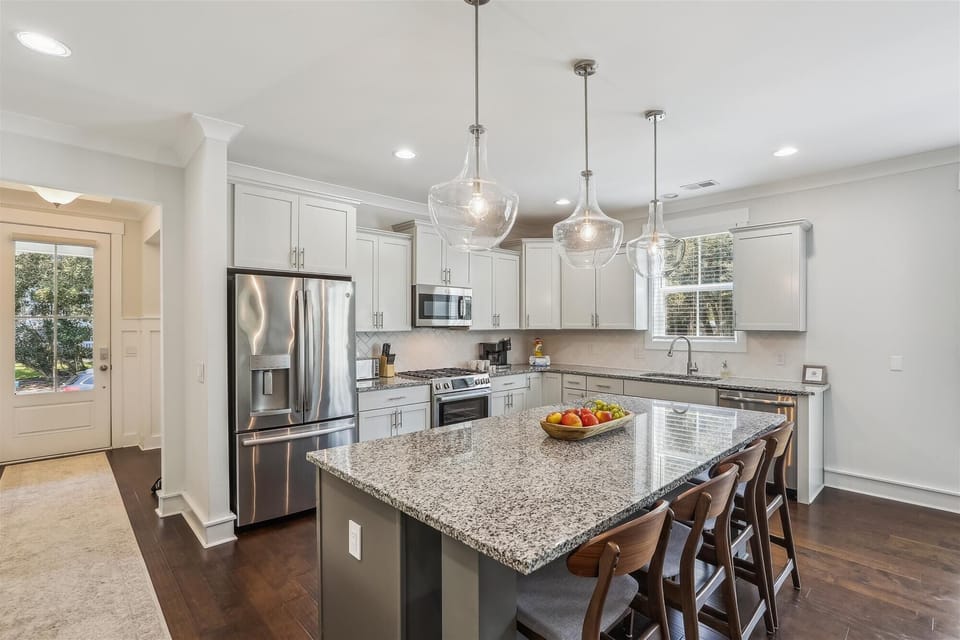 The beautifully designed kitchen, is perfect for culinary delights or coastal gatherings.