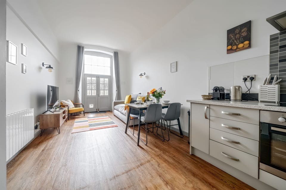 Spacious open plan living with french doors to courtyard
