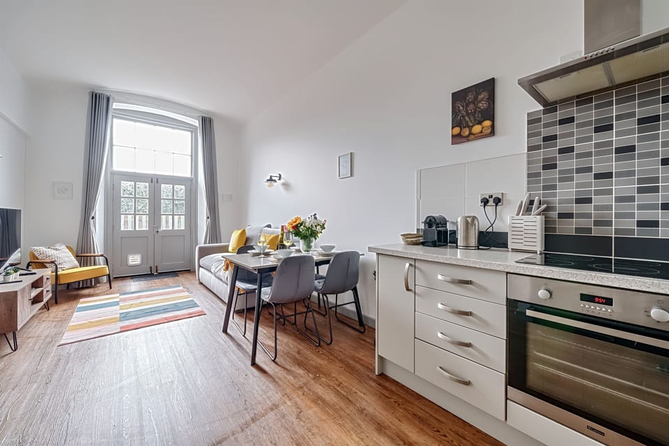 Spacious open plan living with french doors to courtyard