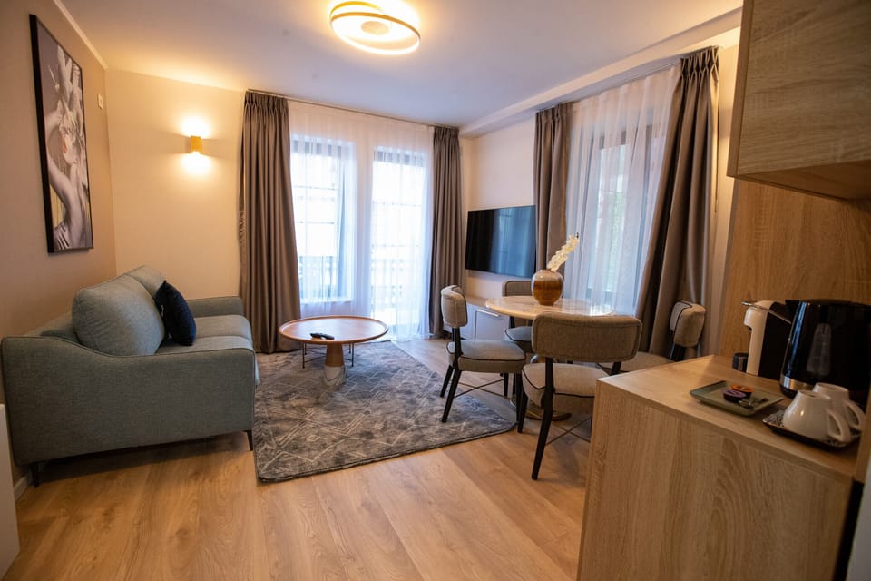 Luxury Apartment | Living area | 55-inch Smart TV with cable channels