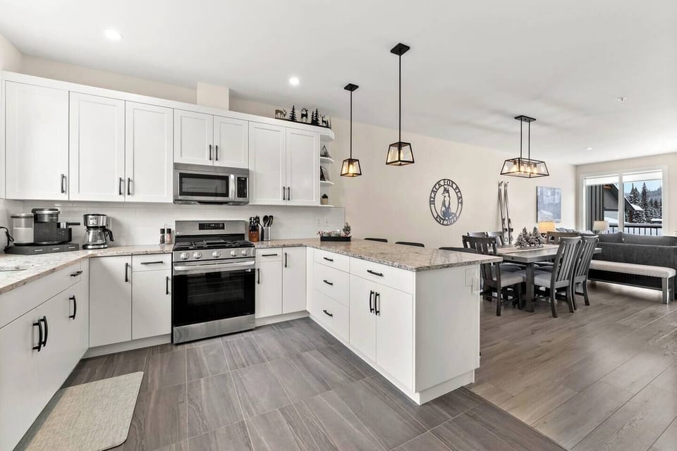 The well equipped kitchen has all new LG appliances with a gas range & air fryer feature oven. The fridge has filtered water & an ice maker. The in floor heating will keep you toasty when you wake up for your first morning coffee. 