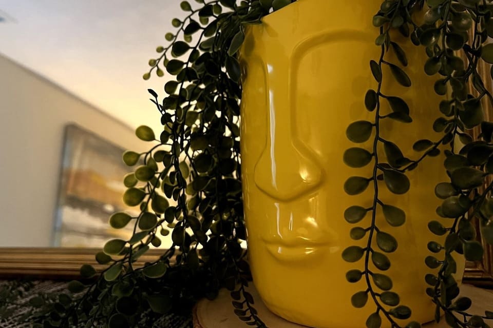 Enjoy the vibrant pop of yellow, evoking the Florida sunshine in the room. Stay connected with charging stations on both nightstands for your convenience.