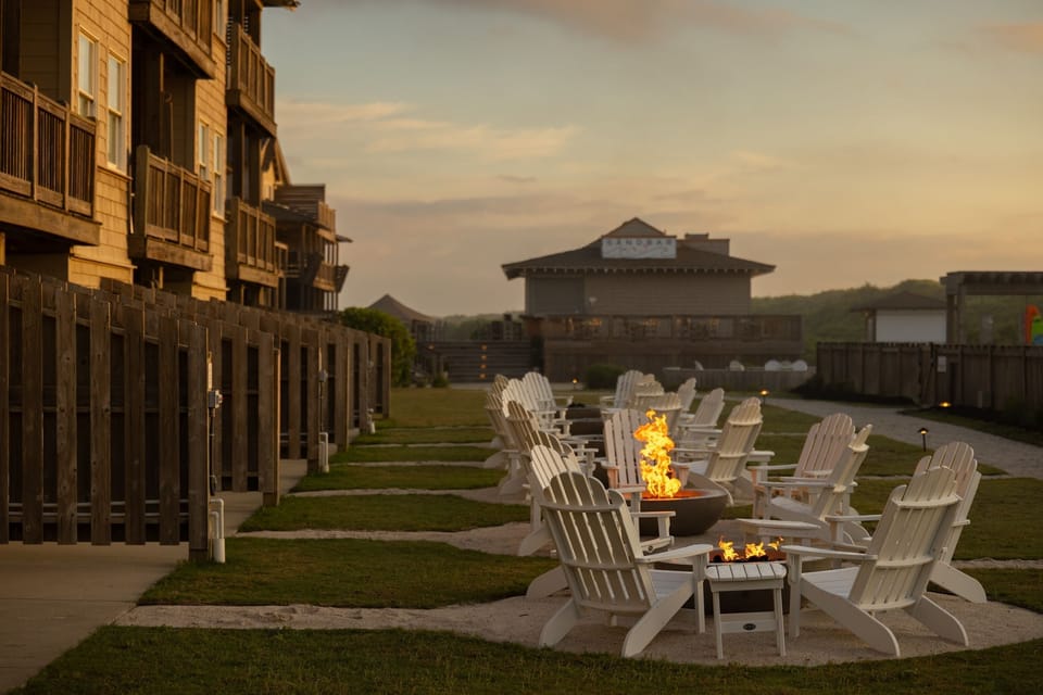Gather around the fire pits as twilight falls, sharing stories under the open sky