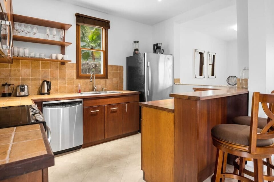 Spacious kitchen includes appliances and all essential cooking utilities.