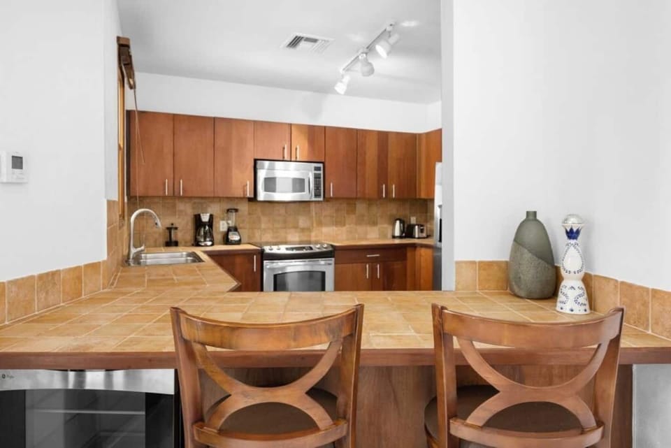 Spacious kitchen includes appliances and all essential cooking utilities.