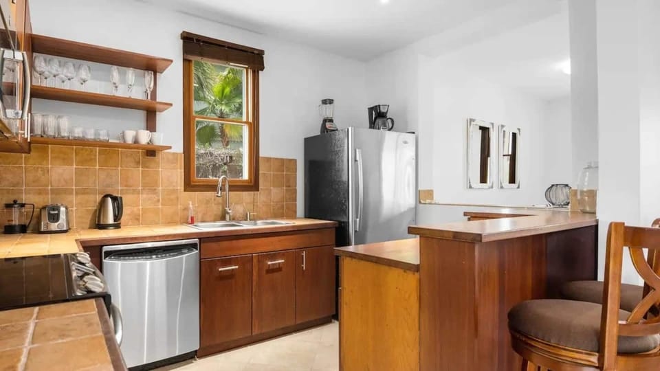 Kitchen is equipped with stainless-steel appliances and cooking basics.