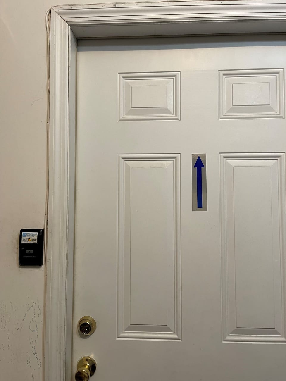 Door to use in garage to stairs. To close garage press white sticker area/button on the left side of this door.