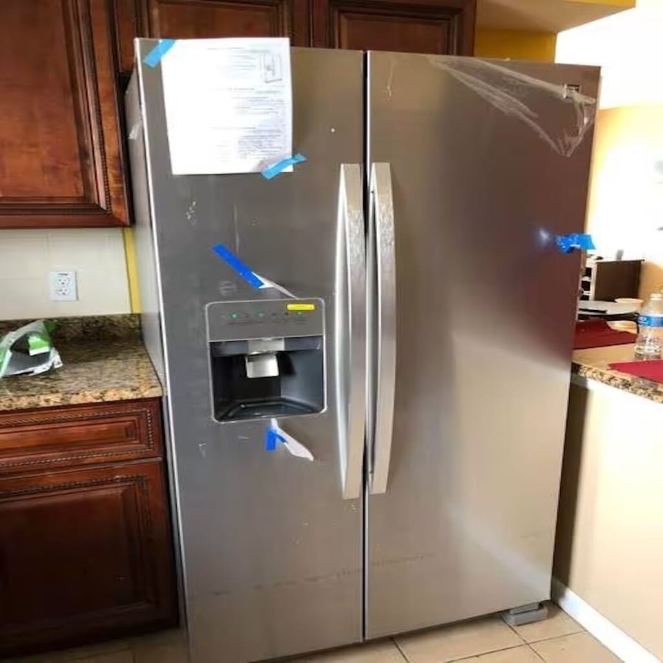 Fridge with filtered water pours out when you push. Ice comes out when press the inner one.