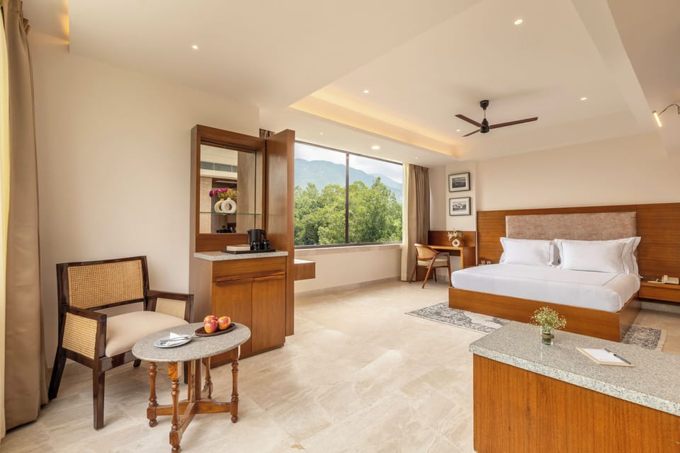 Junior Suite with Jungle View | Minibar, in-room safe, desk, laptop workspace