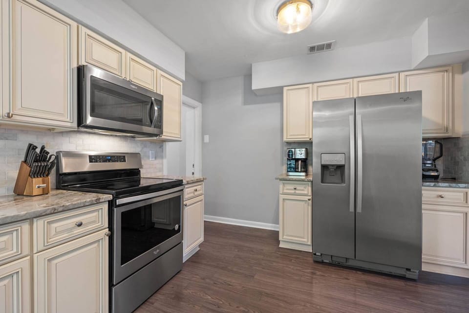 Updated Kitchen with Stainless Steel Appliances, Granite Countertops, and Soft Close Cabinets