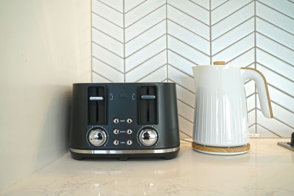 Elite Apartment | Private kitchen | Microwave, highchair